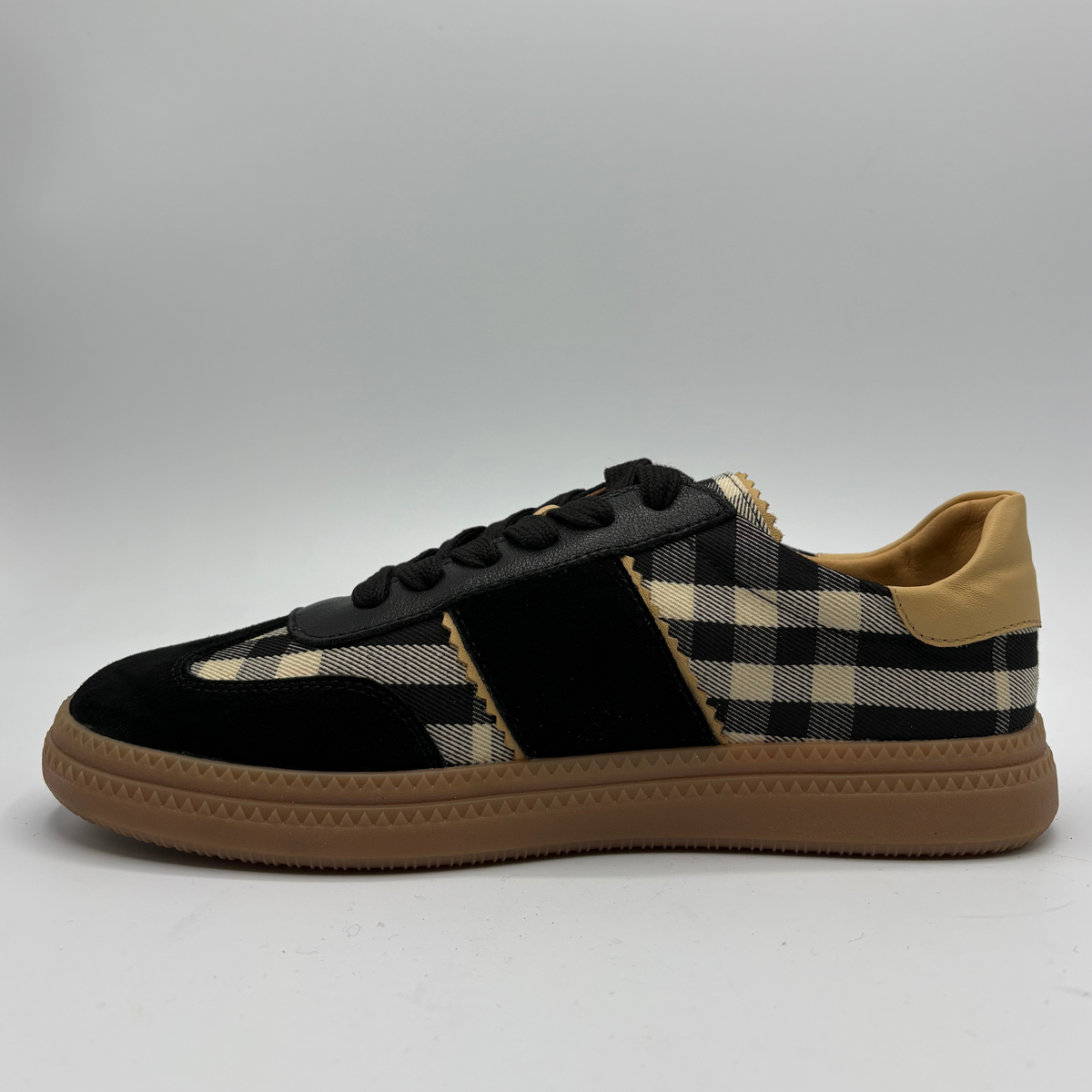 Left facing view of a plaid sneaker with a gum outsole