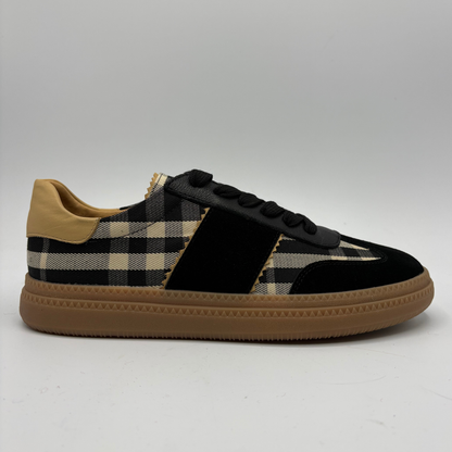 Right facing view of a plaid sneaker with a gum outsole