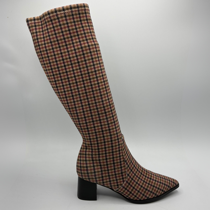 A knee-high pointed-toe boot with a black block heel, featuring a red, black, and white plaid pattern on a clean white background.