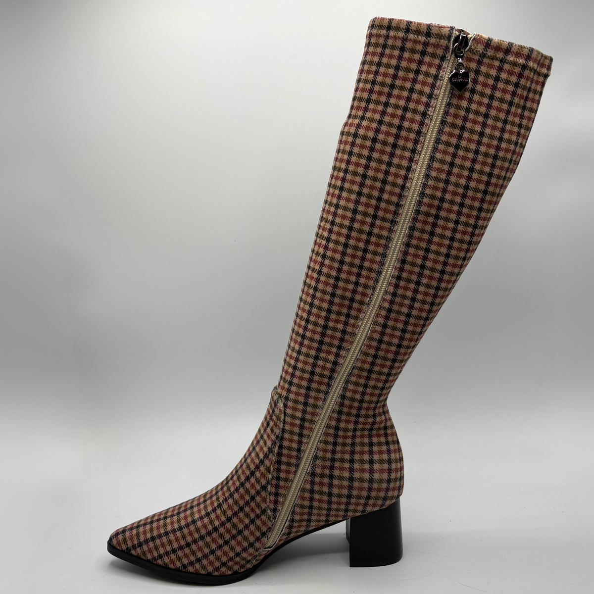 A knee-high pointed-toe boot with a black block heel, featuring a red, black, and white plaid pattern on a clean white background.