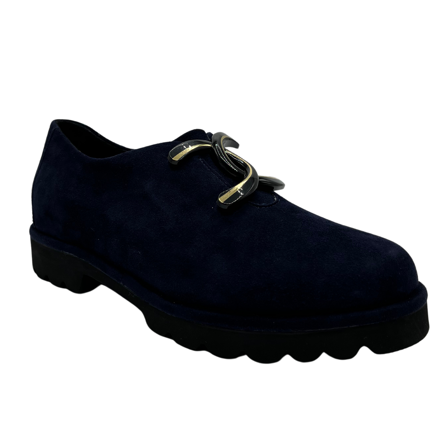 45 degree angled view of navy suede loafer with thick rubber outsole and gold/black detail on upper