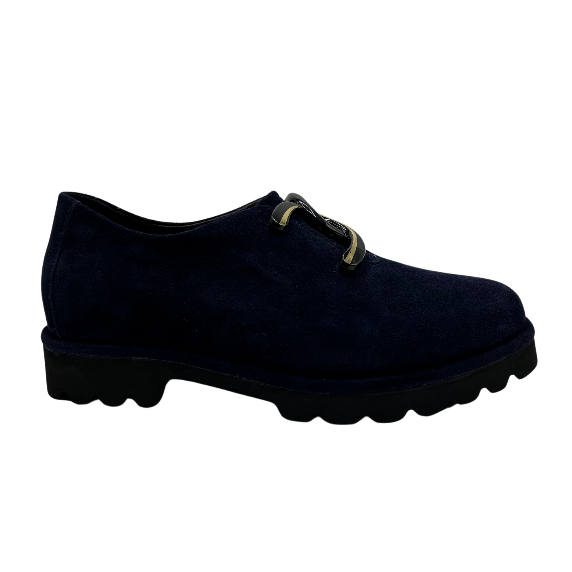 Right facing view of navy suede loafer with thick rubber outsole and gold/black detail on upper