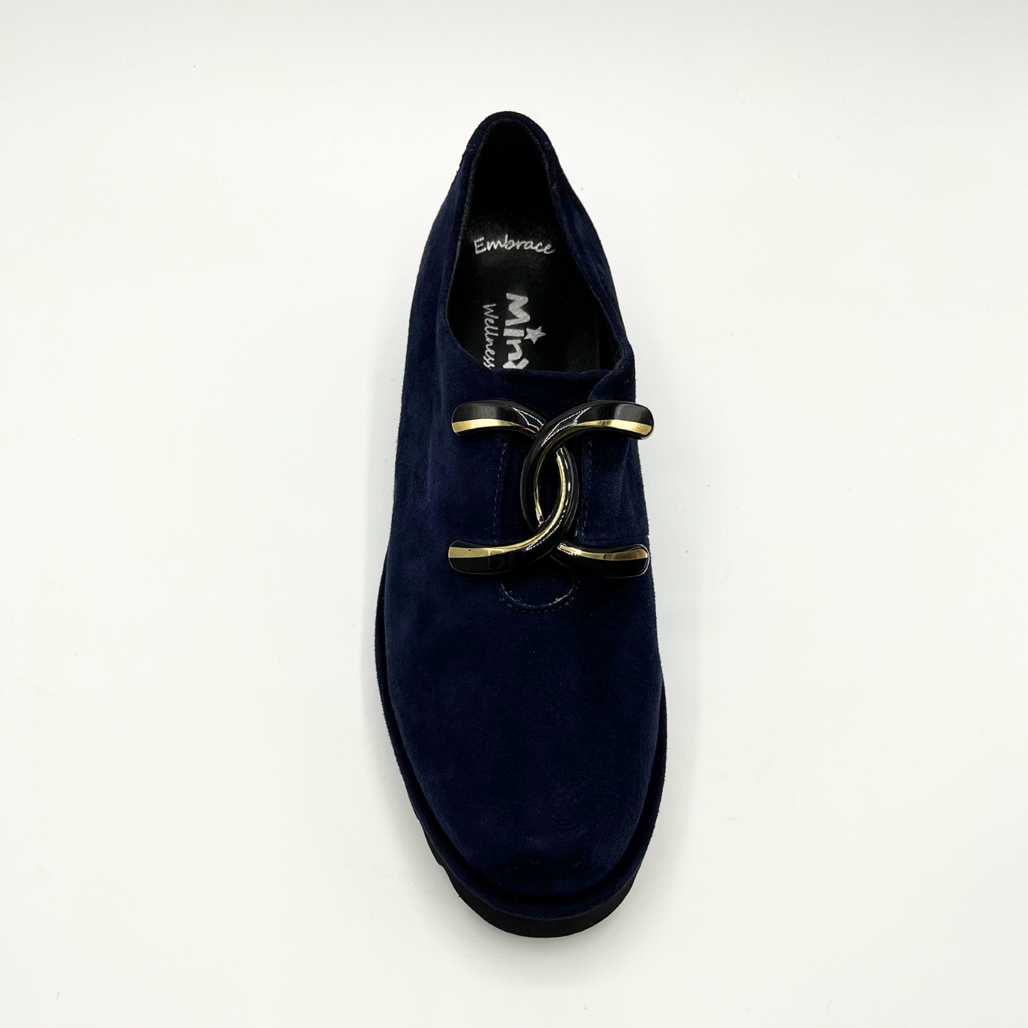 Top view of navy suede loafer with thick rubber outsole and gold/black detail on upper