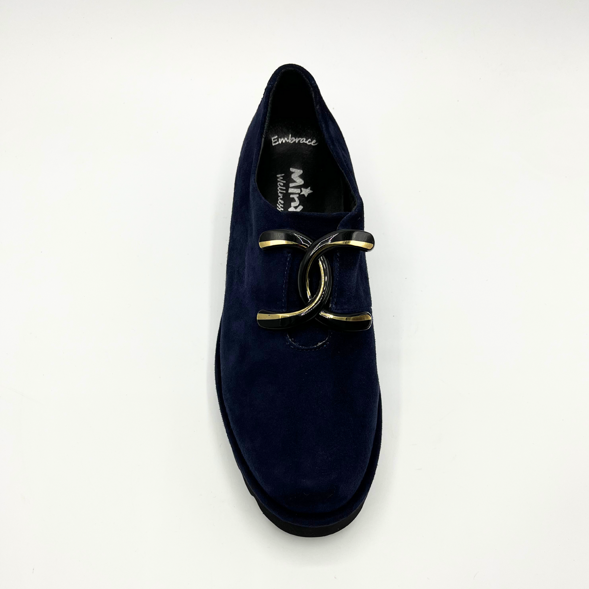Top view of navy suede loafer with thick rubber outsole and gold/black detail on upper