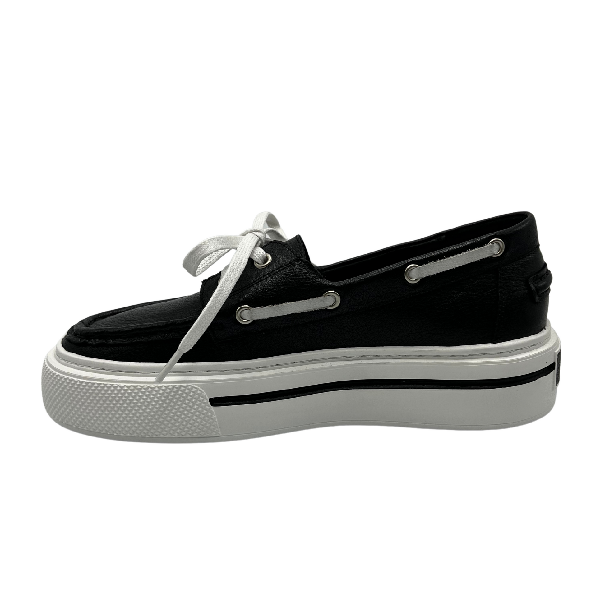 Left facing view of a black leather boat shoe with white rubber platform outsole and white laces