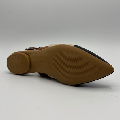 Bottom view of a pointy toe flat shoe with a sling back strap