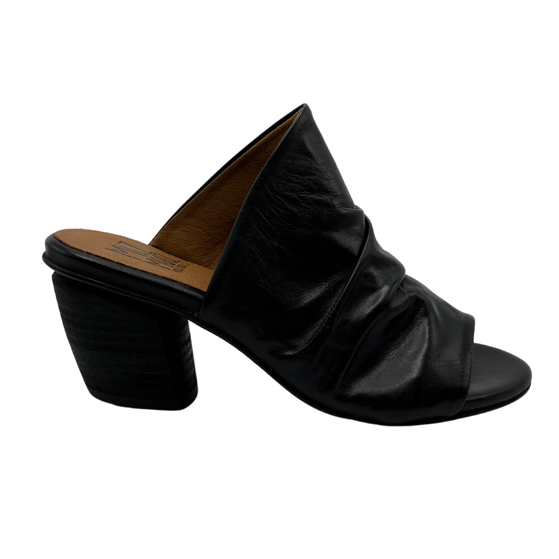 Right facing view of slouchy leather sandal in black. With a muled heel and open toe.