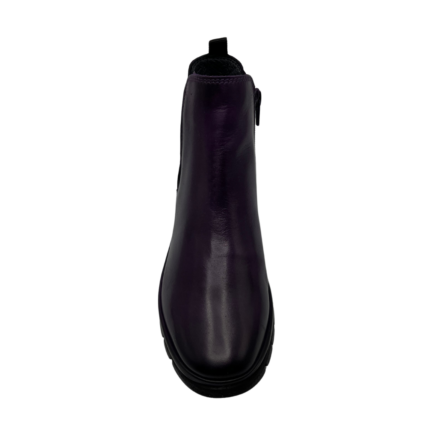 Top view of dark purple leather short boot with slim black outsole and pull on heel tab. Elastic side gore with rounded toe