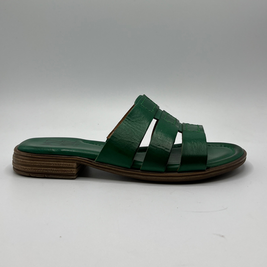 Right facing view of a leather slip on sandal in emerald green with a low stacked heel, and cushioned leather lined insole.