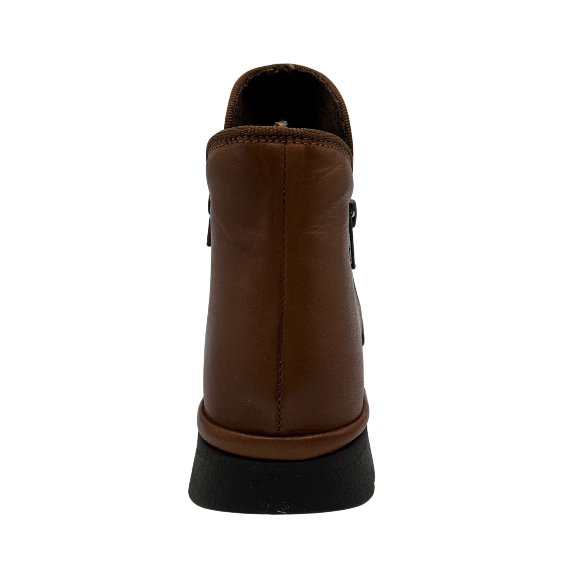 Back view of brown leather ankle boot with slouchy upper, double side zipper closures and slim rubber outsole