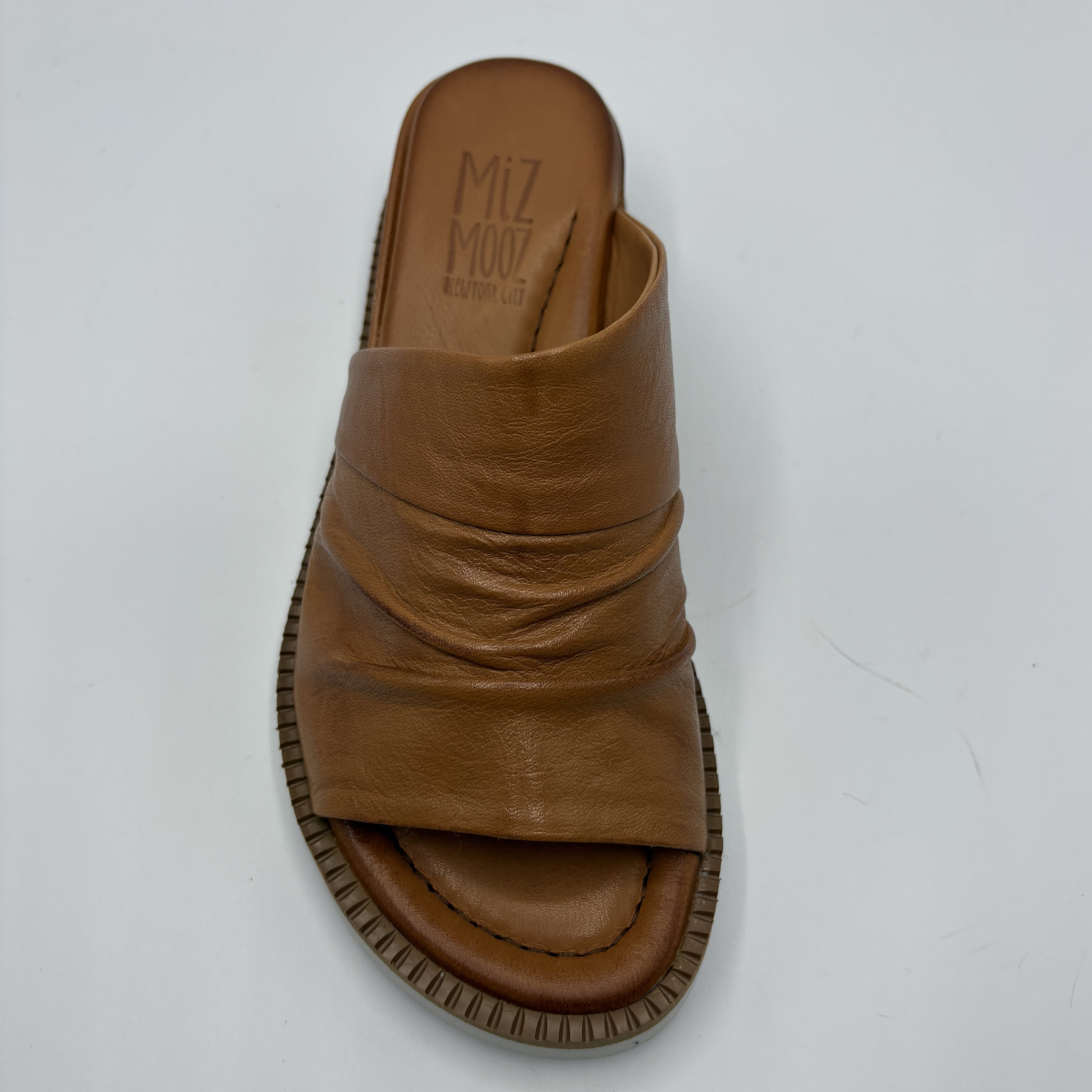 Brown sandal with 'Miz Mooz' branding on a white background