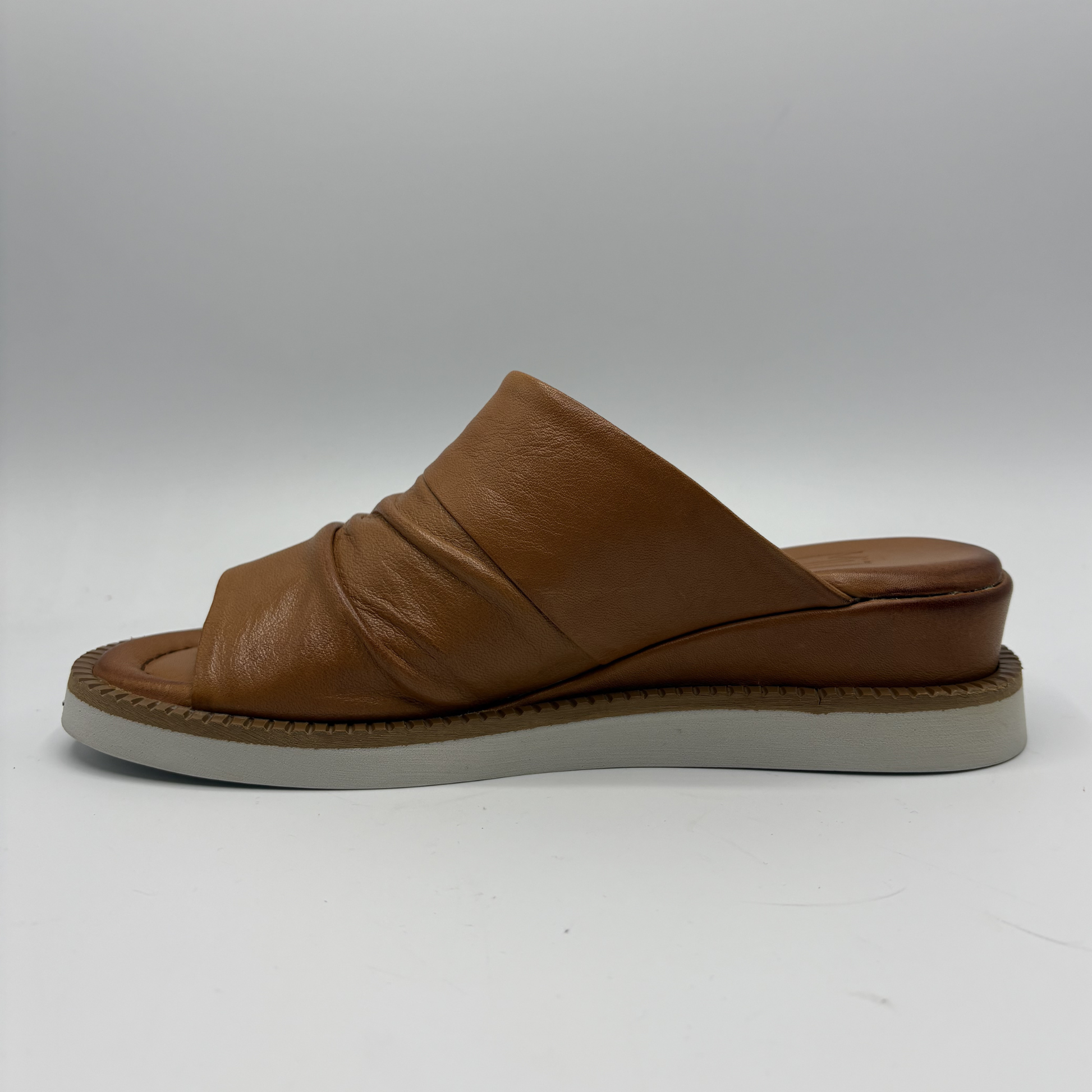 Brown leather sandal on a white background