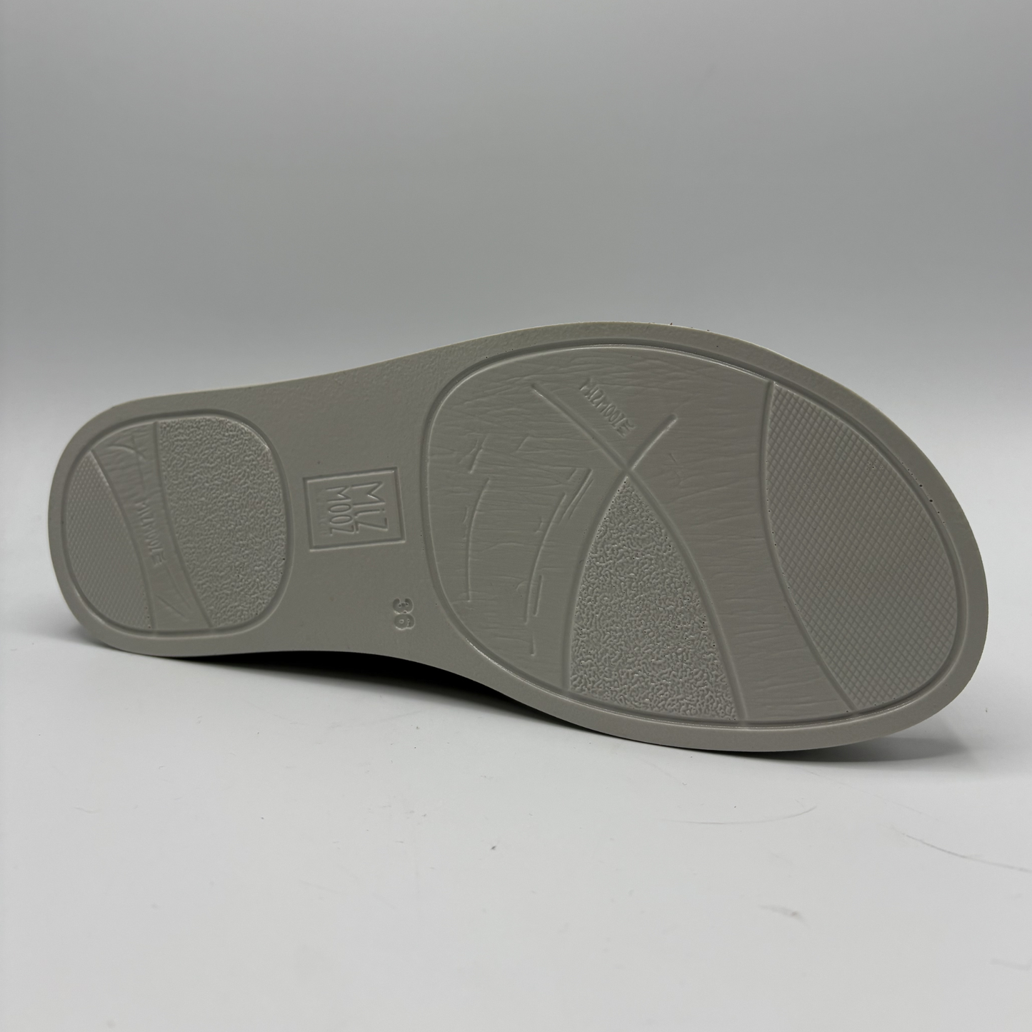 Gray shoe sole on a light gray background