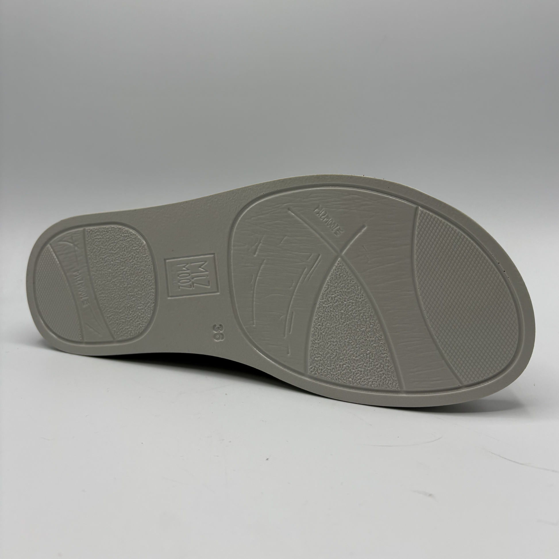 Gray shoe sole on a light gray background