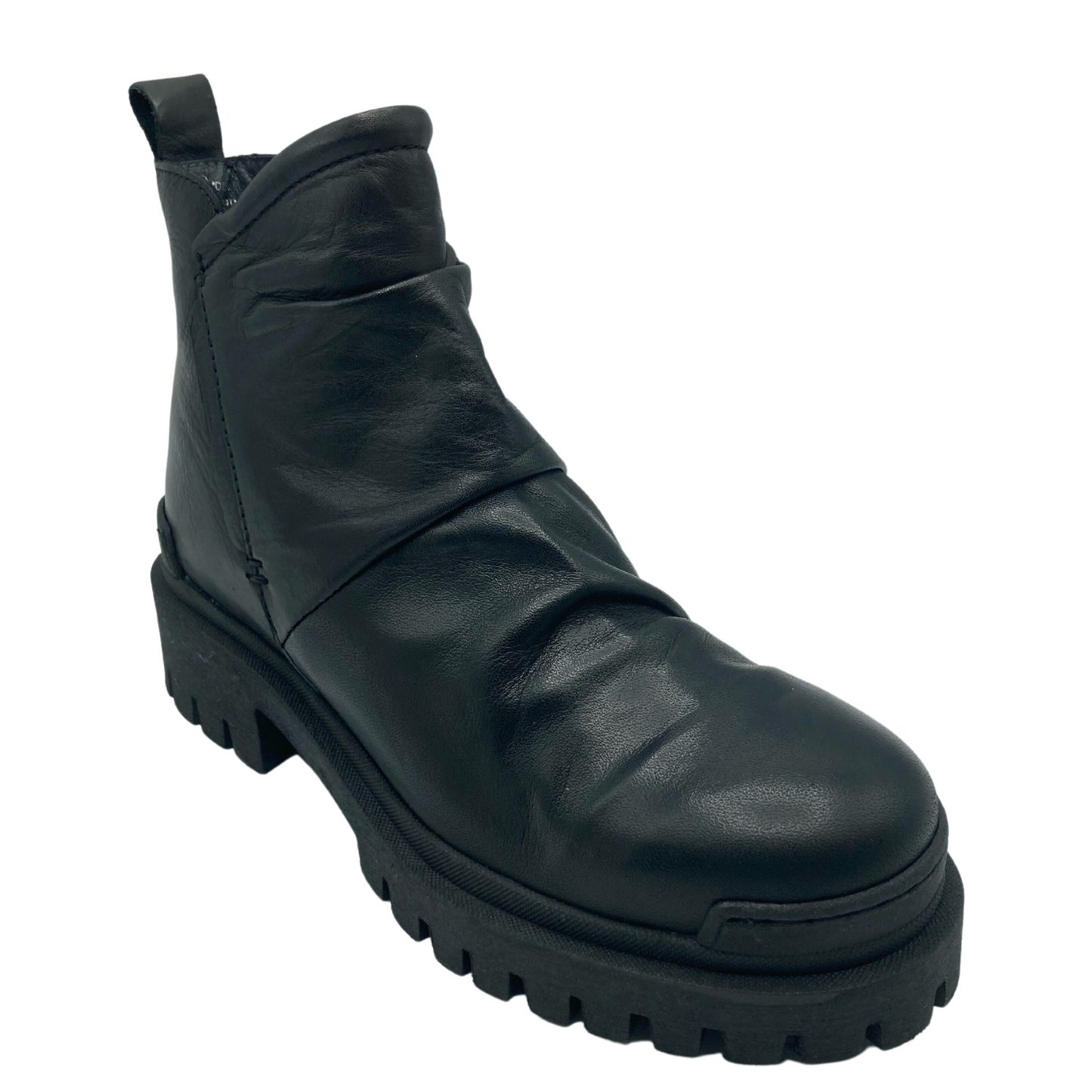 45 degree angled view of short leather boot with rounded toe and rubber outsole
