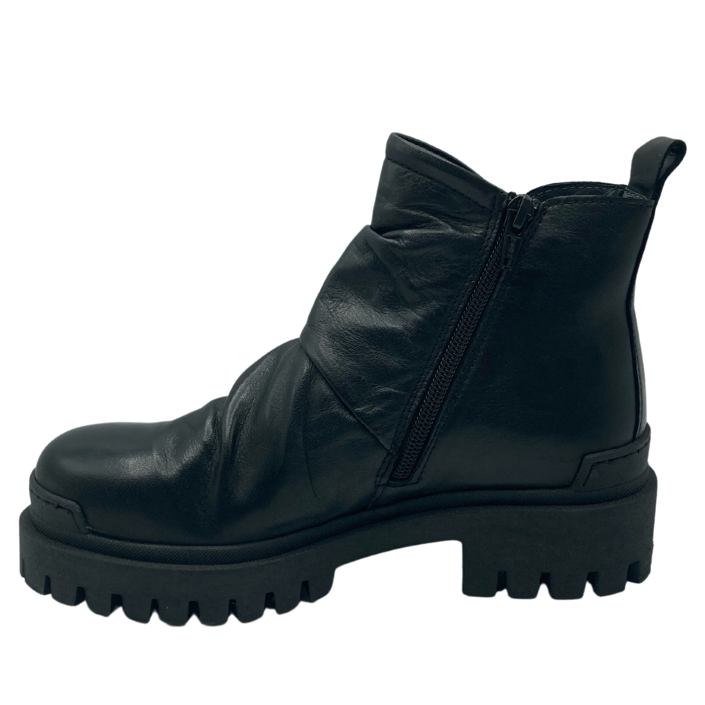 Left facing view of black leather short boot with heel pull tab and side zipper entry
