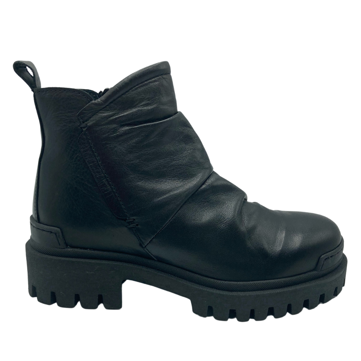 Right facing view of black leather short boot with chunky heeled rubber outsole