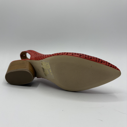 Red shoe with textured sole on a white background