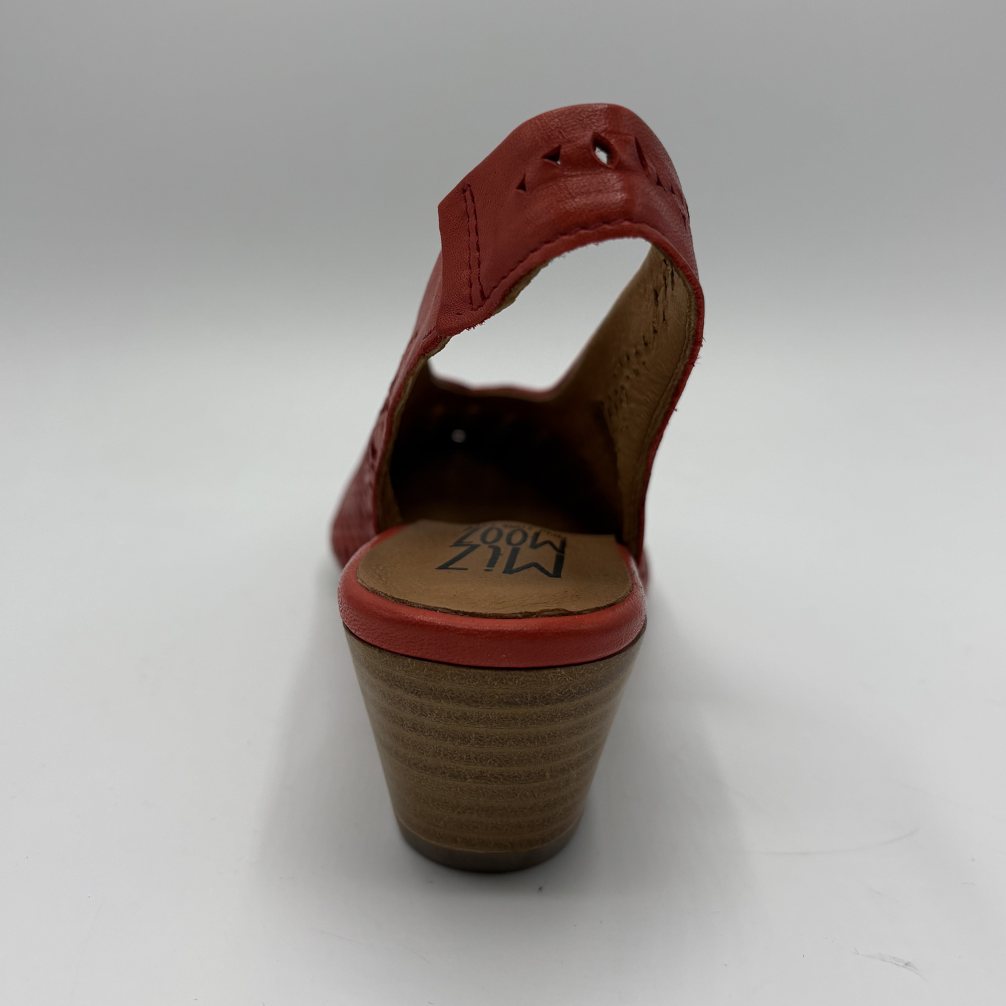 Red sandal with a brown sole on a white background