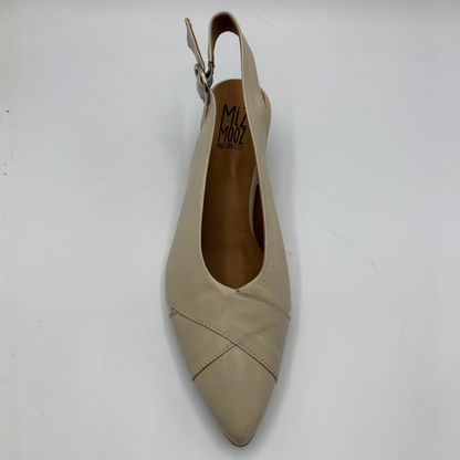 Beige slingback shoe on a white background
