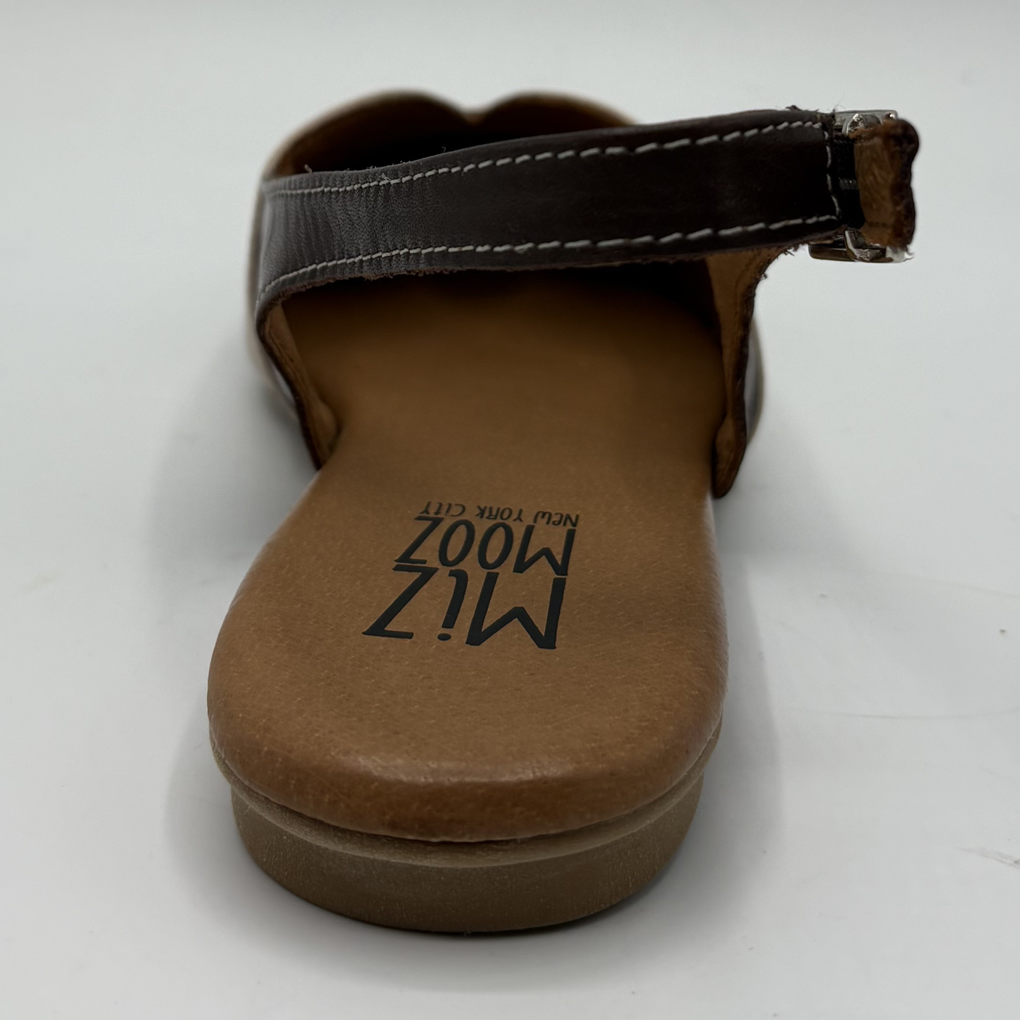 Brown sandal with 'Miz Mooz' branding on a white background