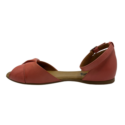 Left facing view of pink leather ballet flat sandal with buckle ankle strap and peep toe.