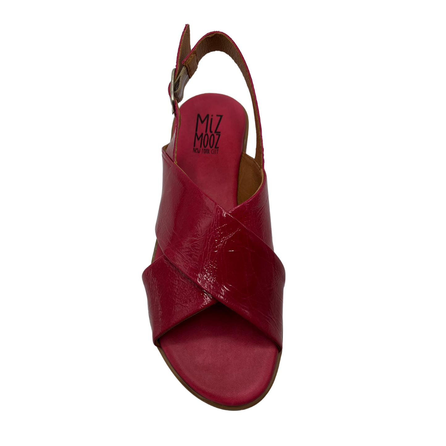 Top view of fuchsia leather flat sandal with low heel, buckle sling back strap and open toe