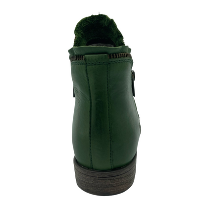 Heel view of green leather ankle boot with block heel