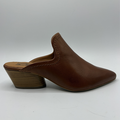 Brown leather mule shoe on a white background