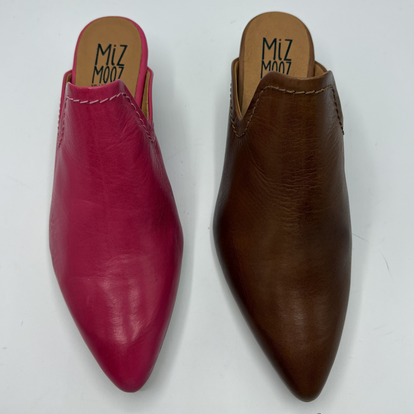 Pink and brown pointed-toe shoes with 'Miz Mooz' branding on a white background