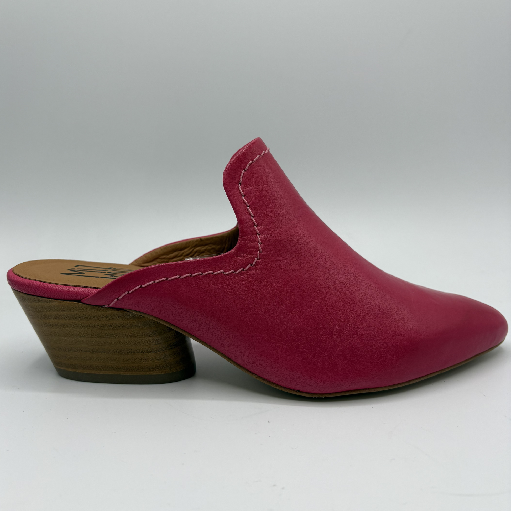 Magenta leather mule shoe on a white background