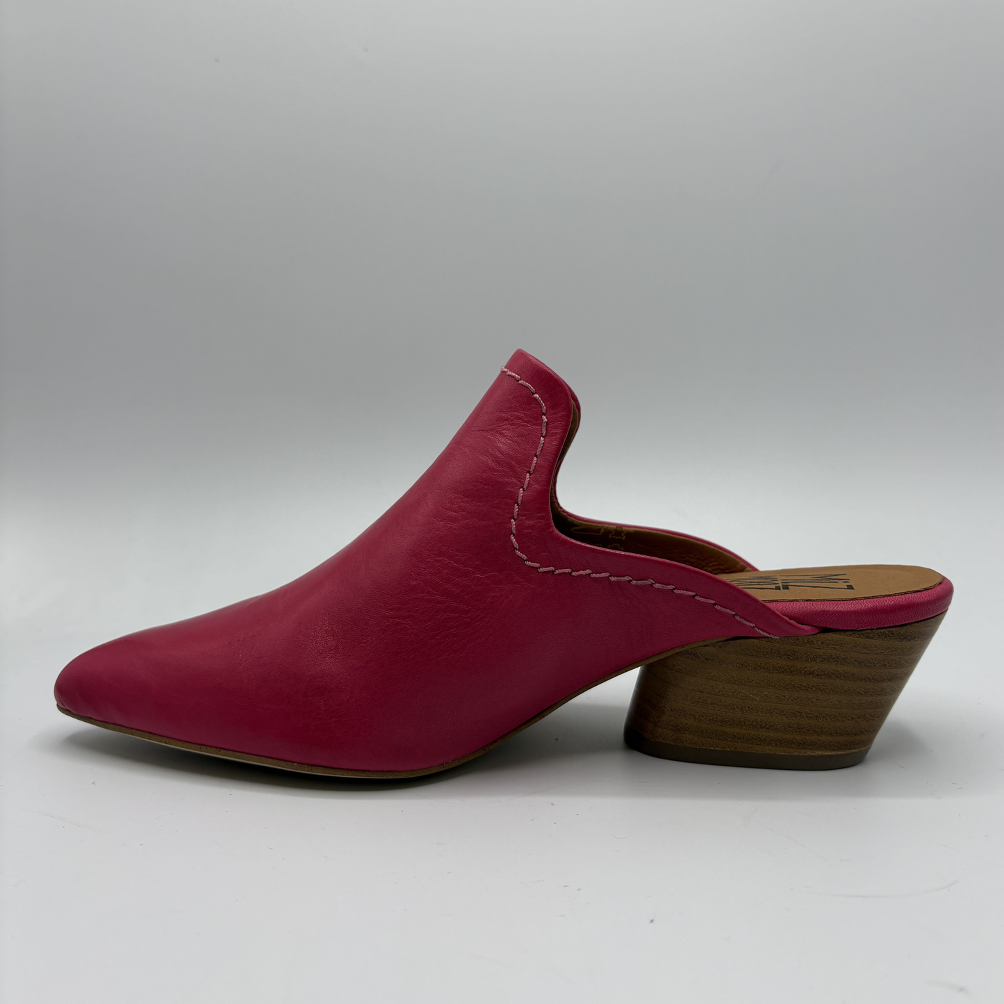 Red leather mule shoe on a white background