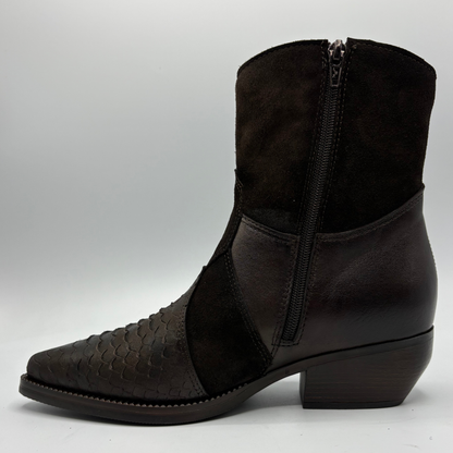A dark brown ankle boot with a mix of textured python-patterned leather, smooth leather panels, and a dark brown suede-like shaft, featuring a side zipper.