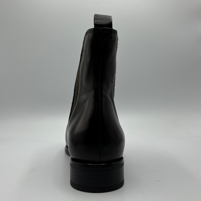 Chestnut leather boot on a gray background