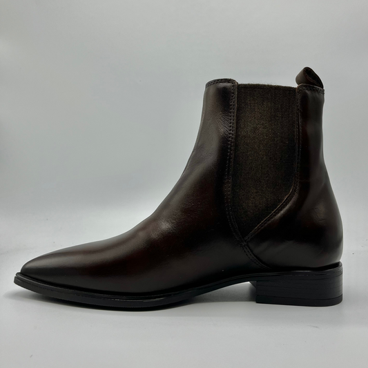 Dark brown leather Chelsea boot on a light gray background