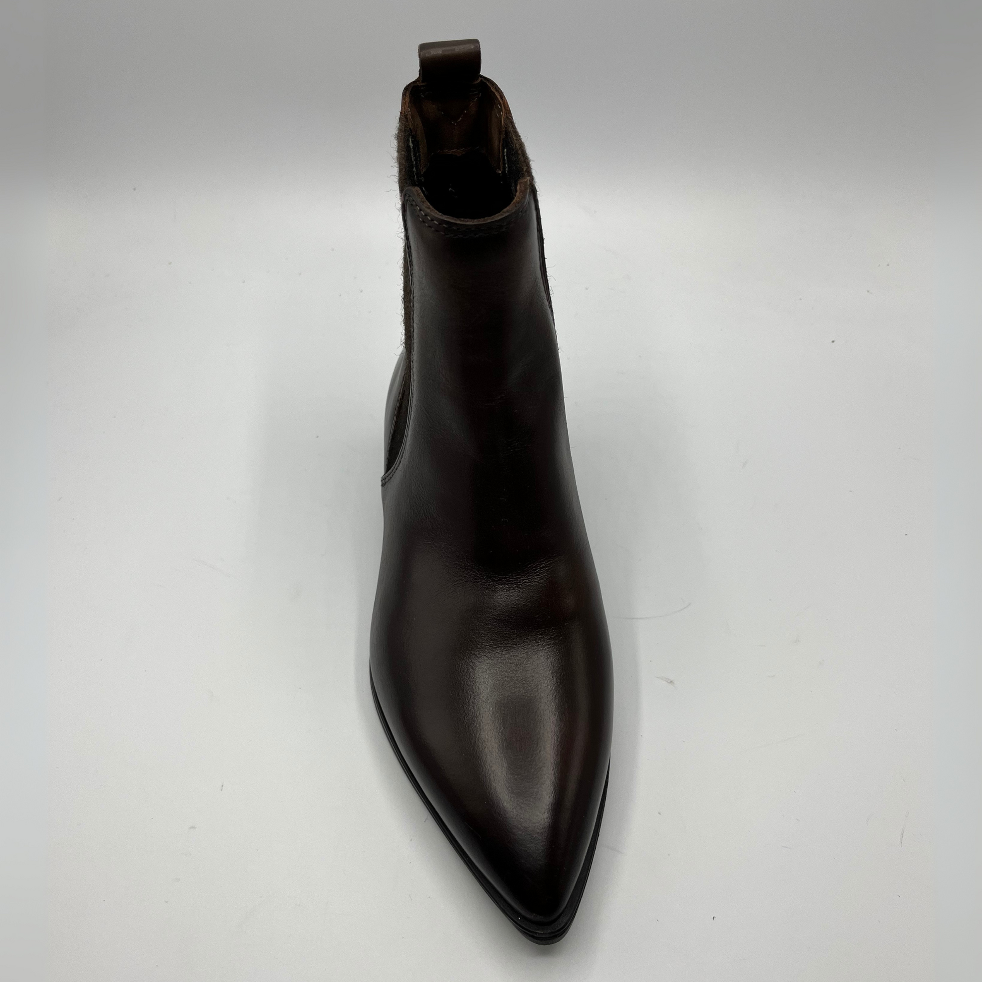 Black leather boot on a white background