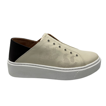 Right facing view of latte coloured sneaker with black heel and white rubber outsole