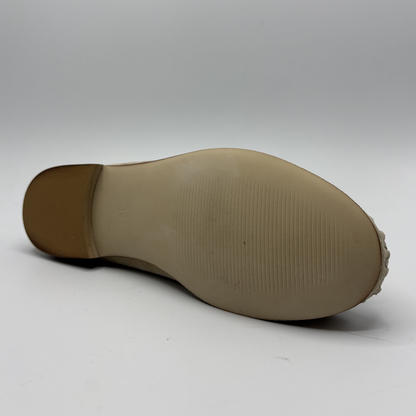 Close-up of a brown shoe sole on a white background