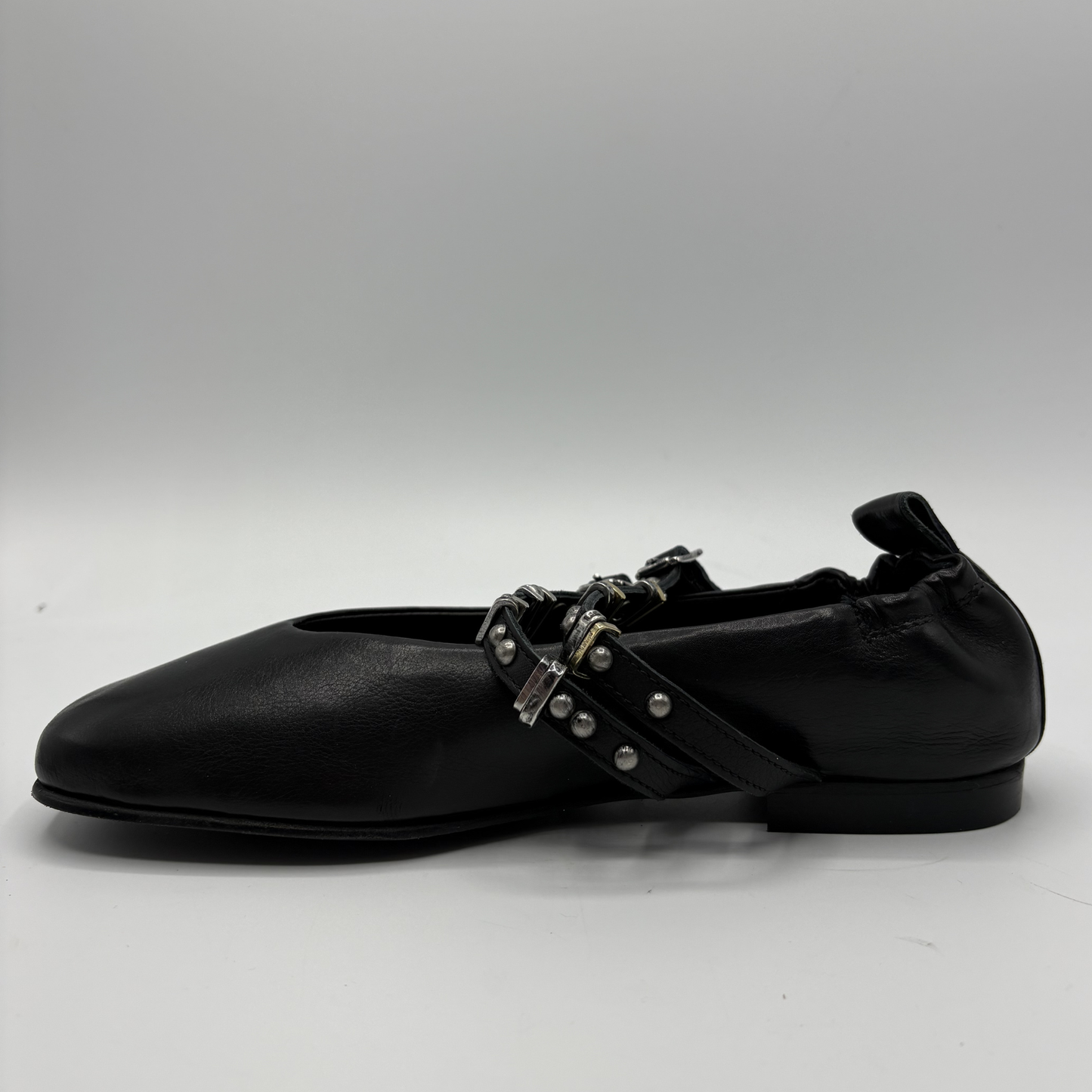 Black flat shoe on a white background