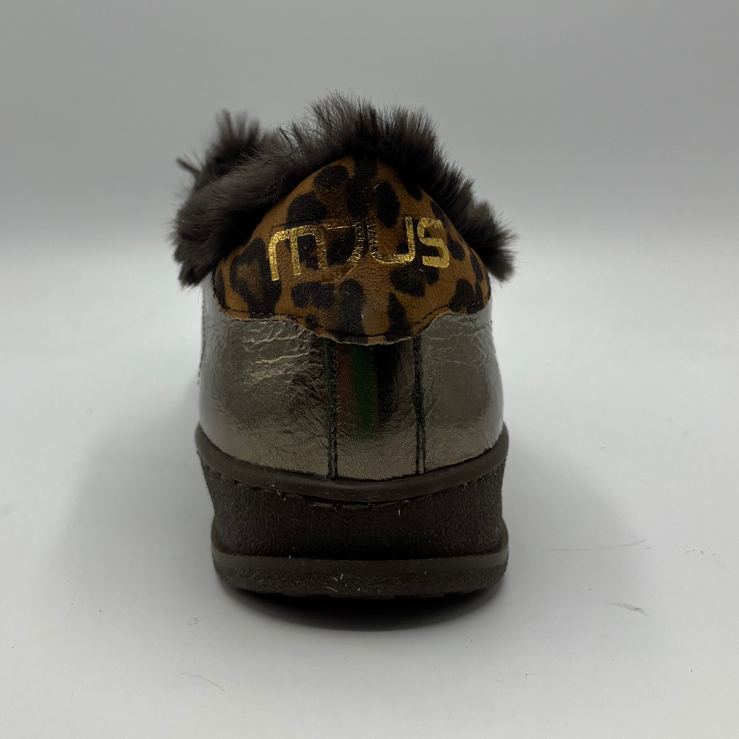 Metallic shoe with leopard print fur on a white background