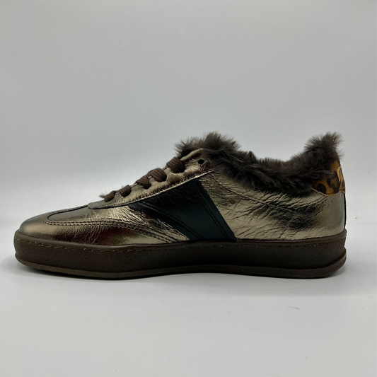 Sneaker with fur trim on a white background