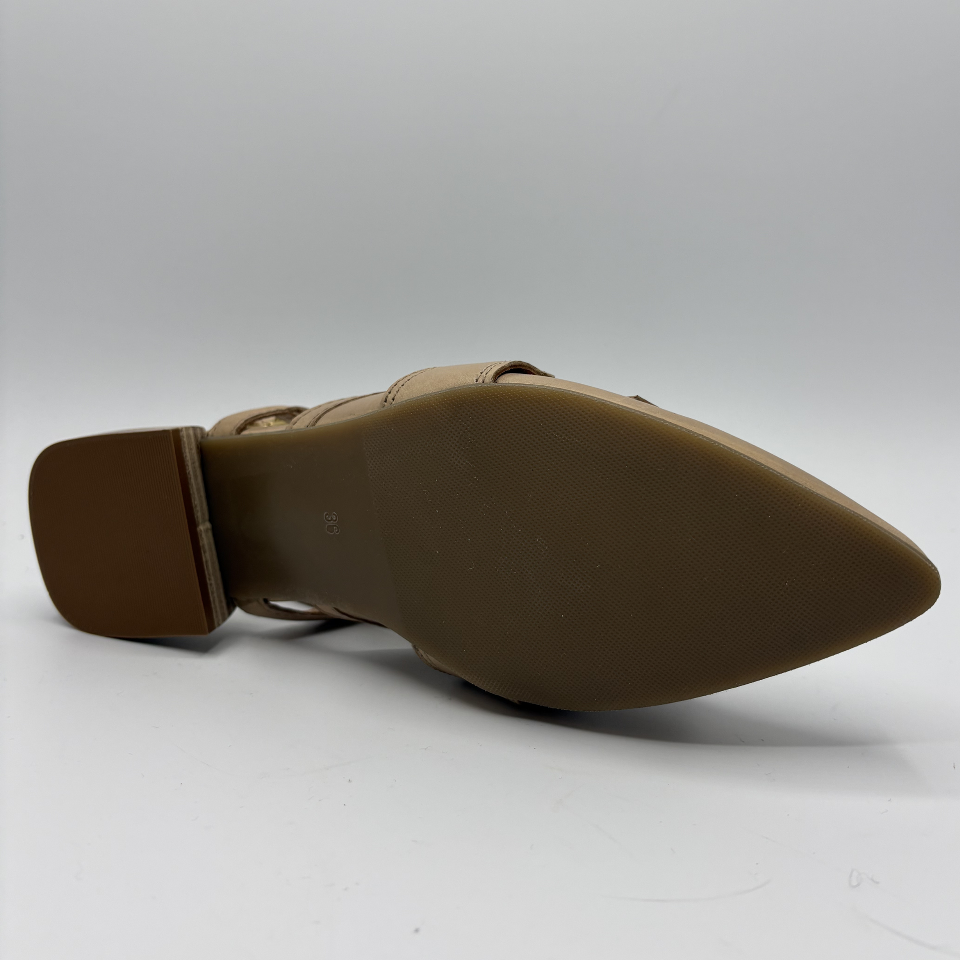 Brown pointed-toe shoe on a white background