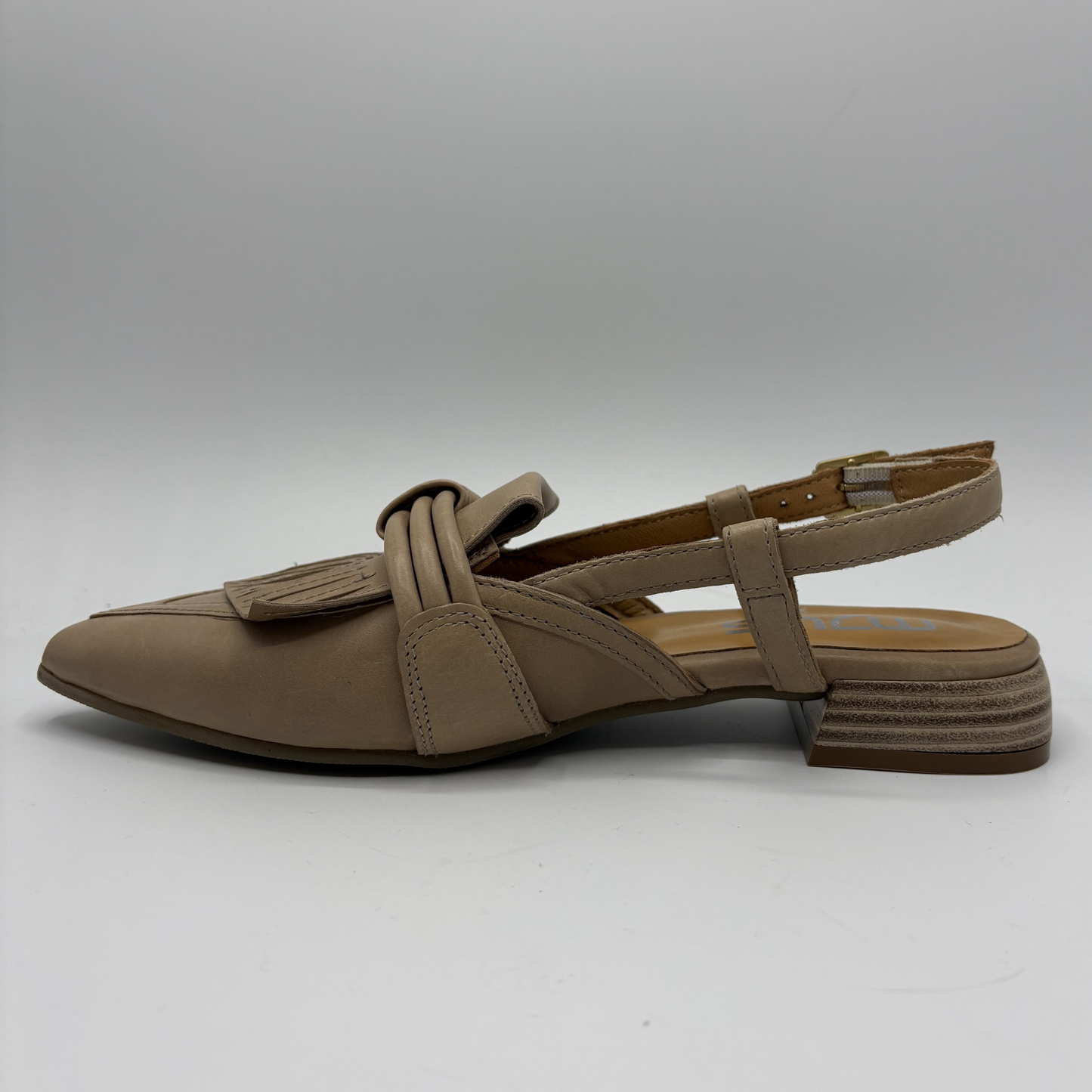Beige sandal with a strap on a white background