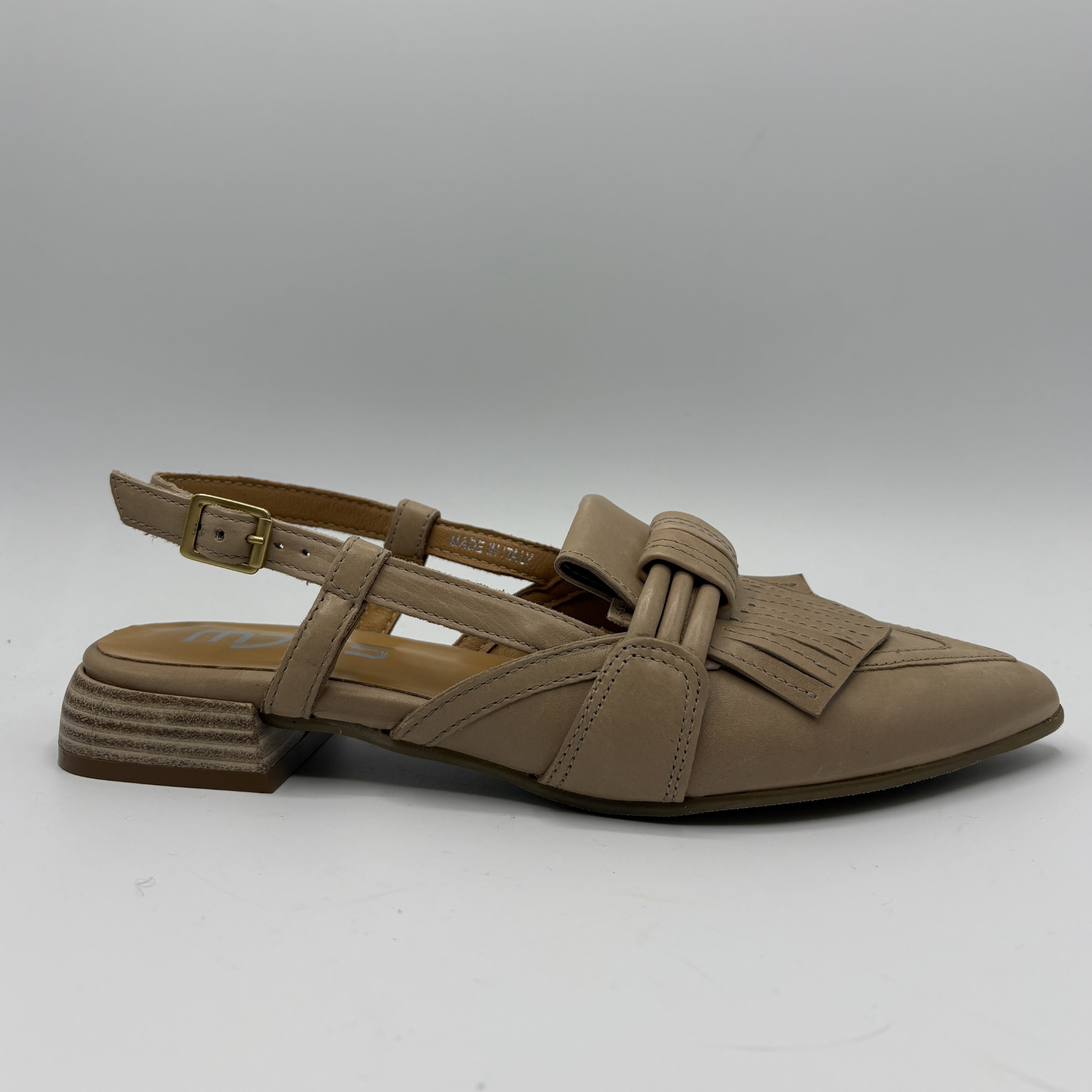 Brown sandal with strap design on a gray background