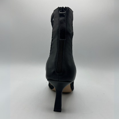 Back view of a black mesh heeled boot