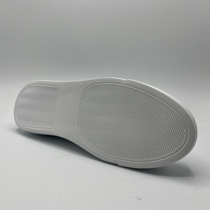 Bottom view of a leather sneaker with a white rubber outsole