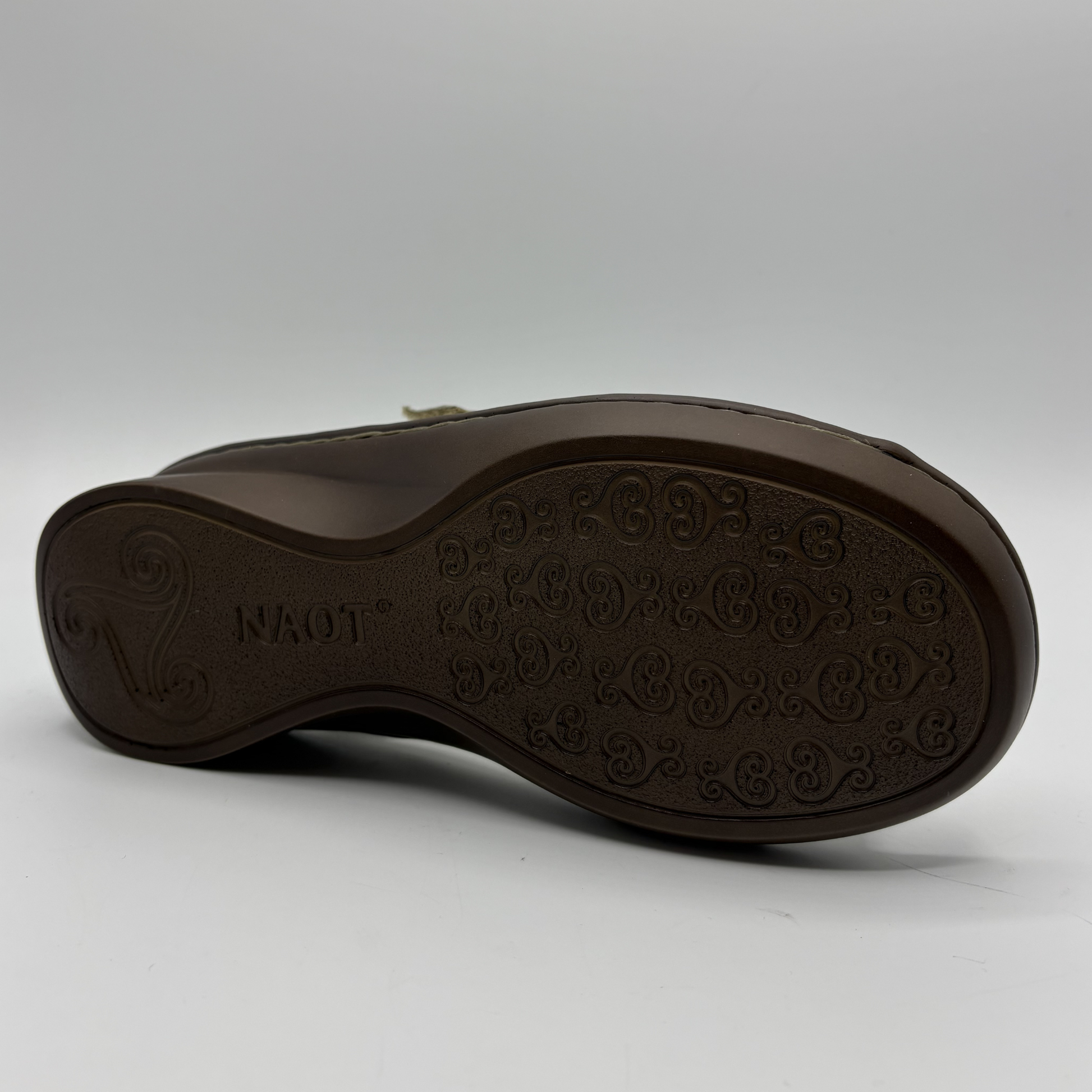 Bottom view of a taupe sandal
