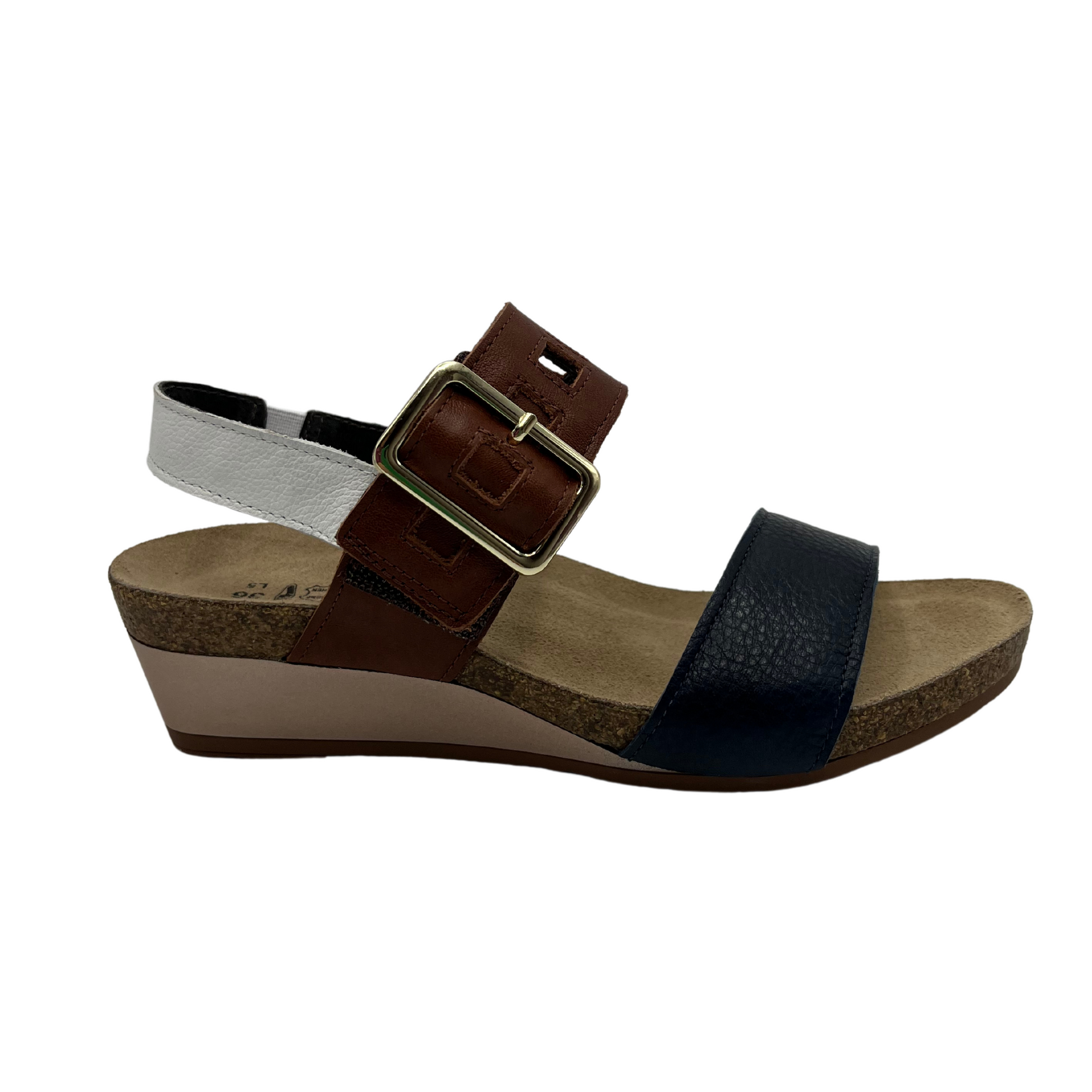 Right view of leather sandal with a large buckle strap with low wedge heel