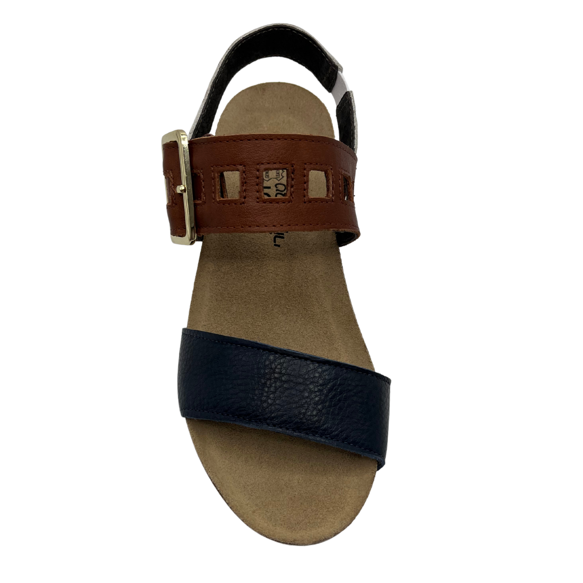 Top view of leather sandal with a large buckle strap with low wedge heel