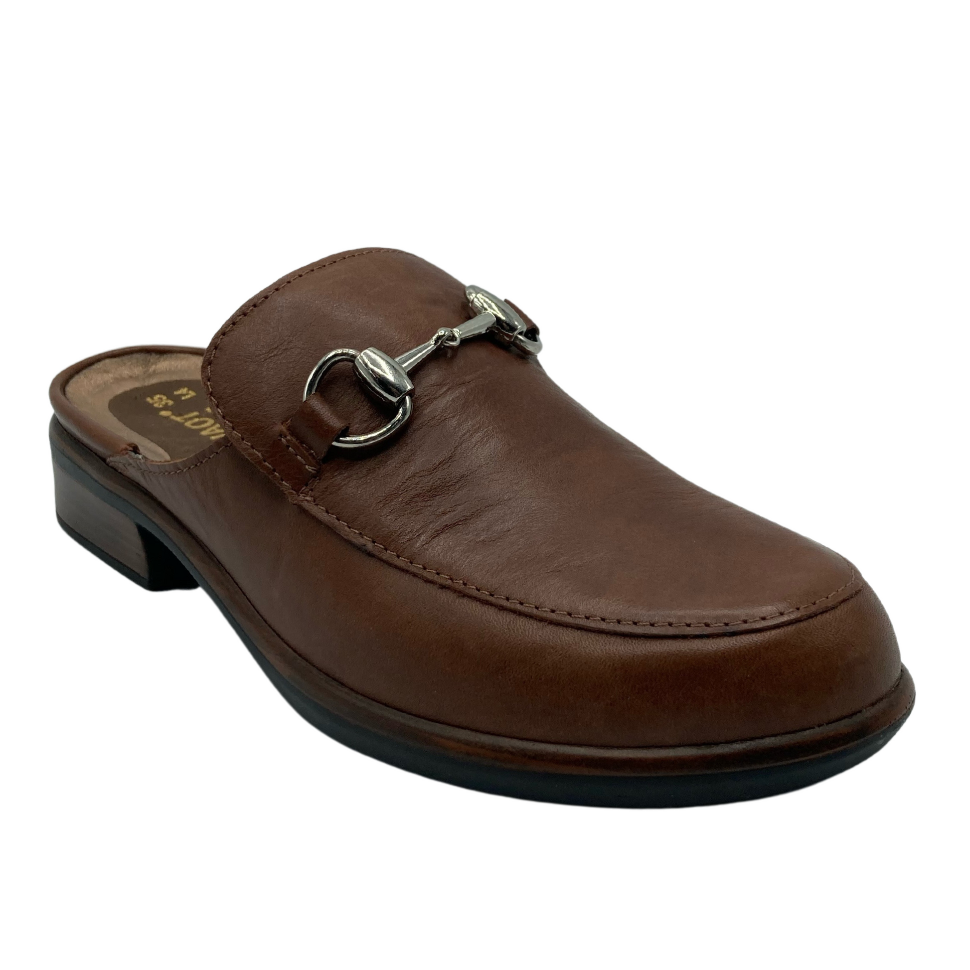 45 degree angled view of brown leather loafer slide with 1.5 inch heel with silver bit detail on upper